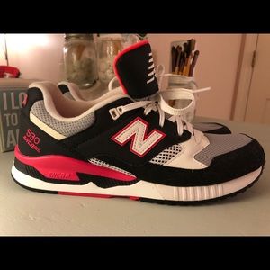 Black, white and pink New Balance E30 Encaps.